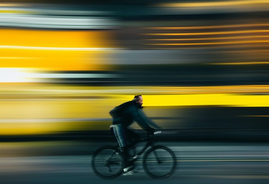 man riding bicycle on road during daytime